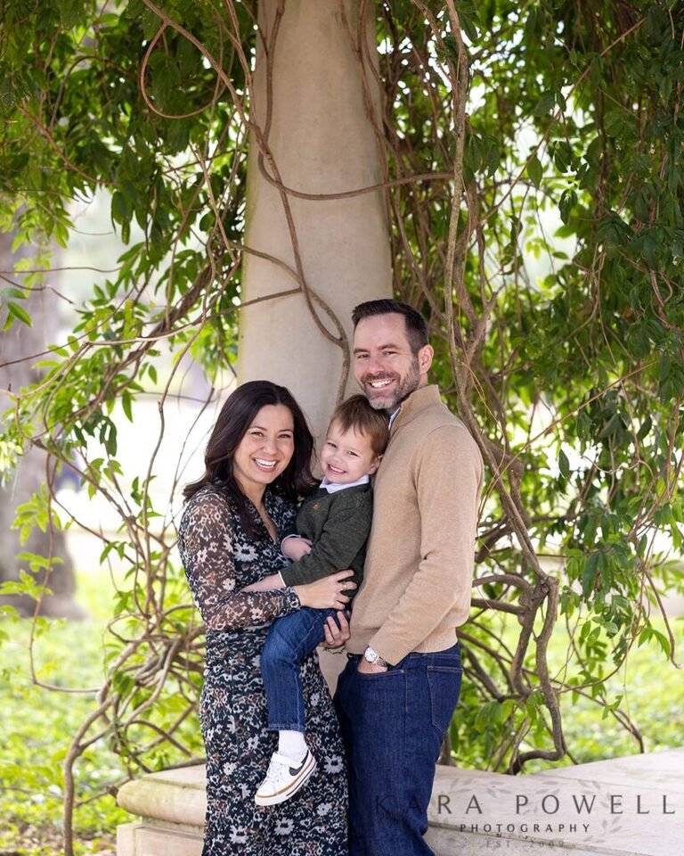 Family of three at their Memorial Park sunrise session with Kara Powell Photography.