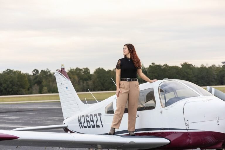 Conroe TX senior on her airplane during senior portraits. Kara Powell Photography