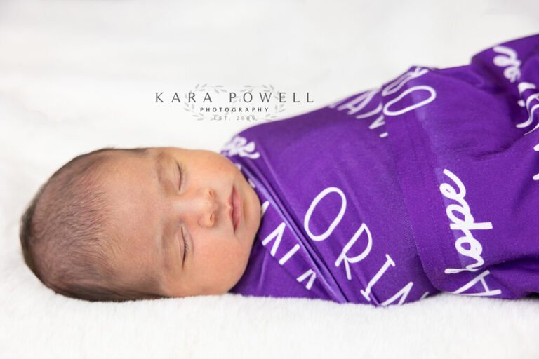 Houston TX newborn baby girl during her in-home newborn session. Taken by Kara Powell Photography.