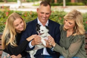 Couple with their daughter and small dog in the Woodlands TX