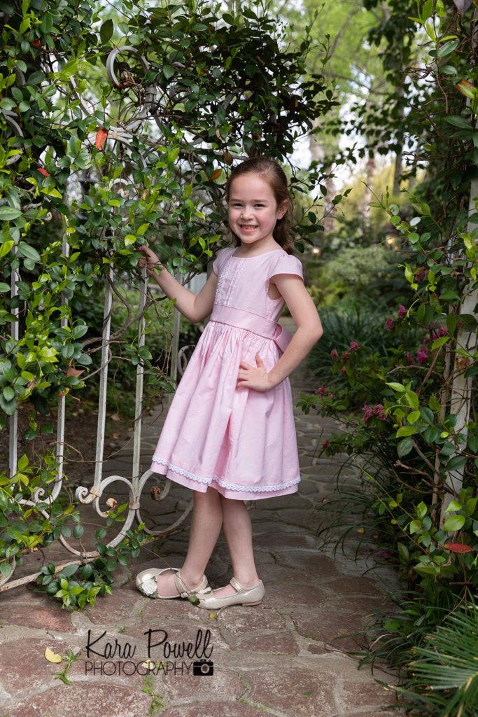 Five year old in secret garden mini sessions in Conroe TX