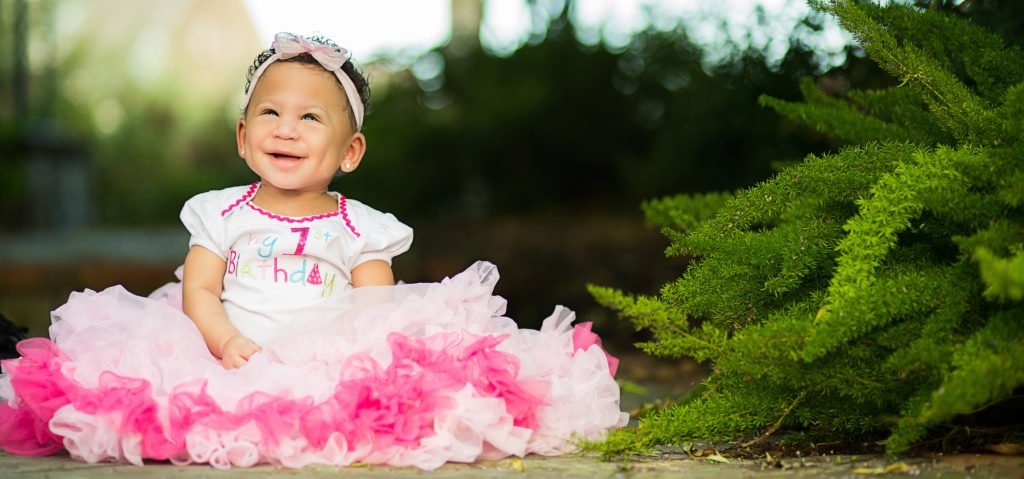 One year photo session of a little girl in a pink tutu