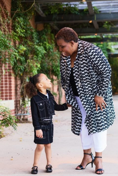 Generational Photography - Grandma and granddaughter smile at each other