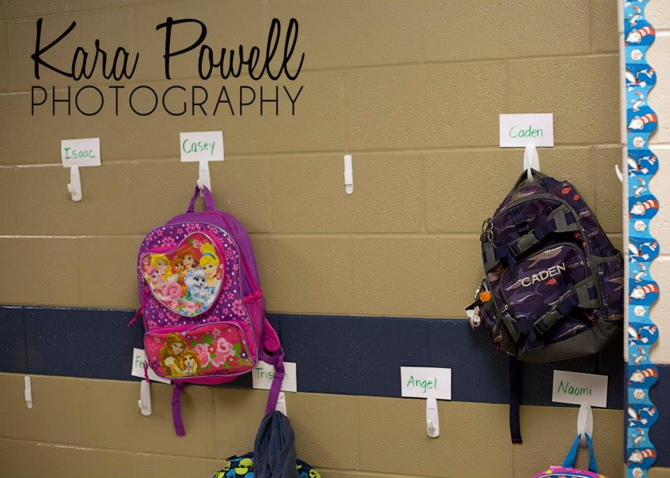 first day of school photos - backpacks hanging on the wall