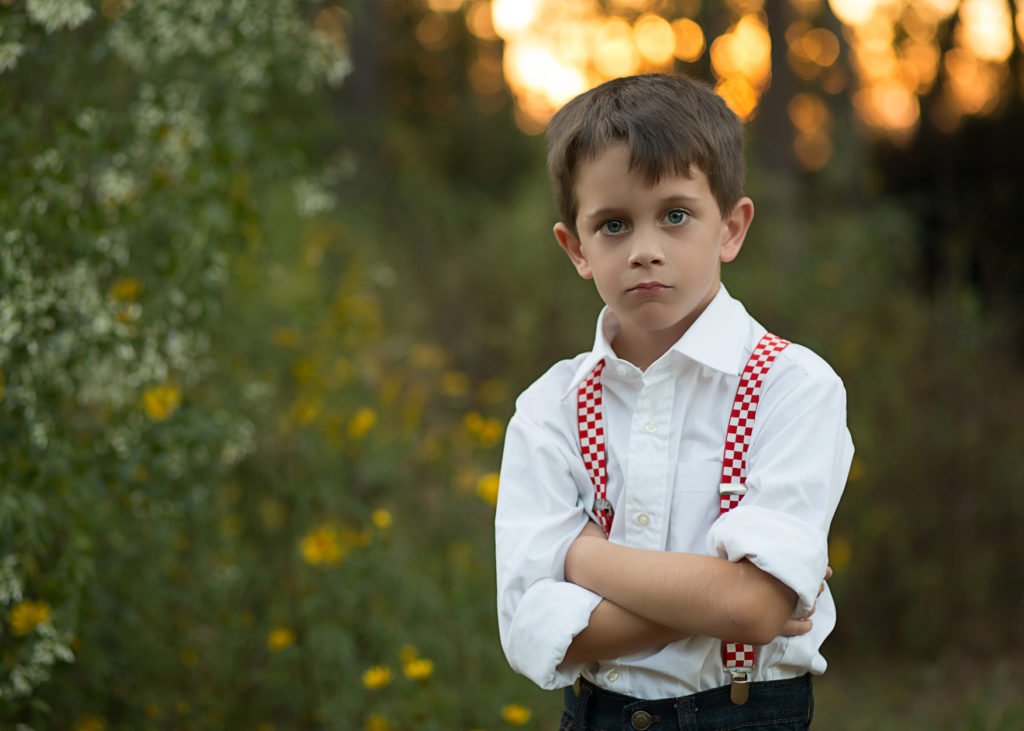 School Photos alternative, young boy standing in the woods