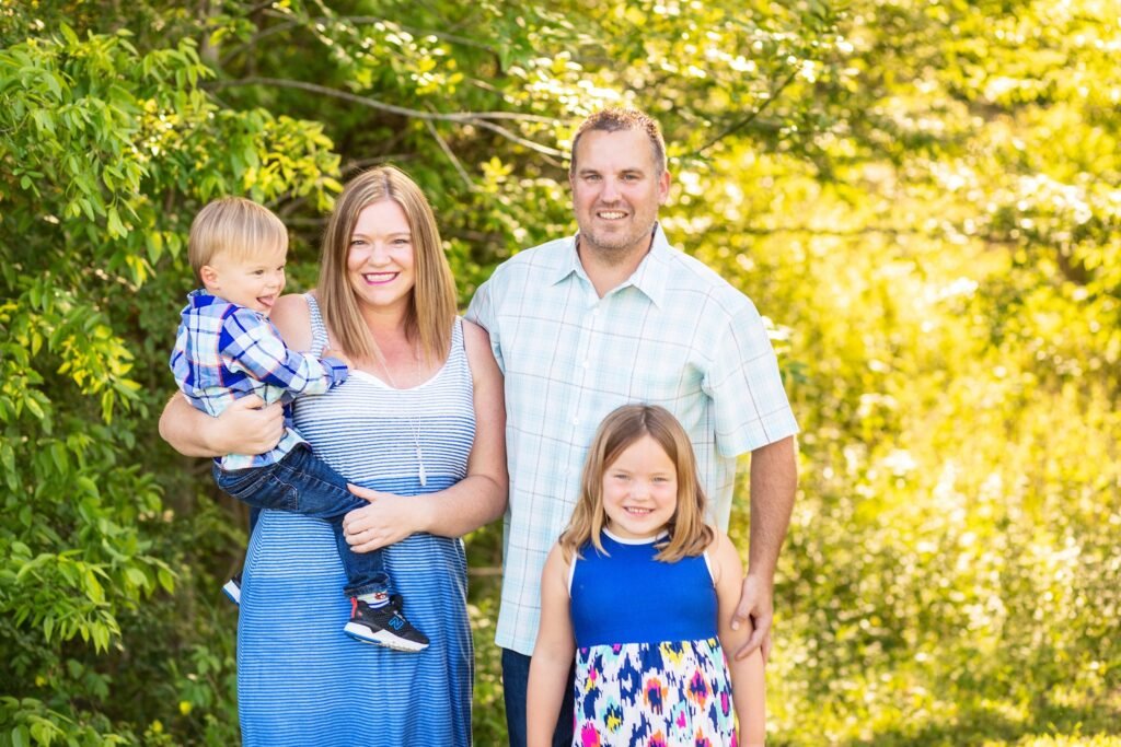 Family of four in Montgomery TX during their bluebonnet session with Kara Powell Photography.