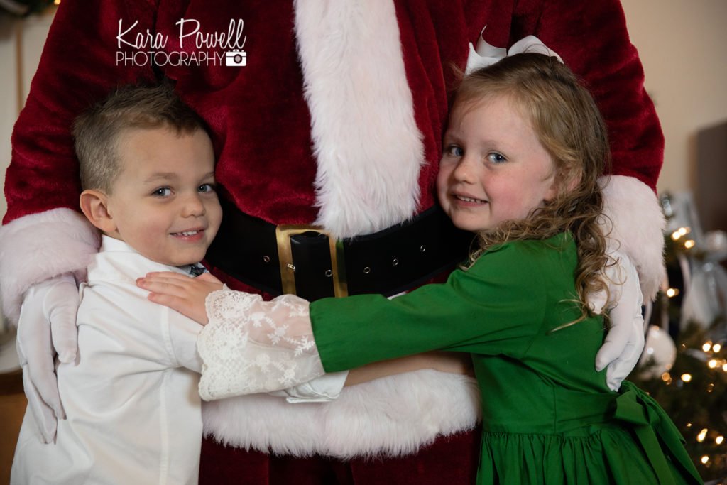 Woodlands TX siblings spend quiet time with Santa at Kara Powell Photography's studio