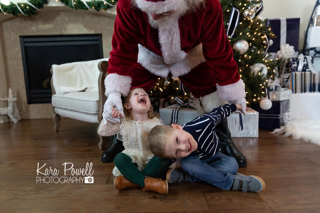Woodlands TX siblings spend quiet time with Santa at Kara Powell Photography's studio