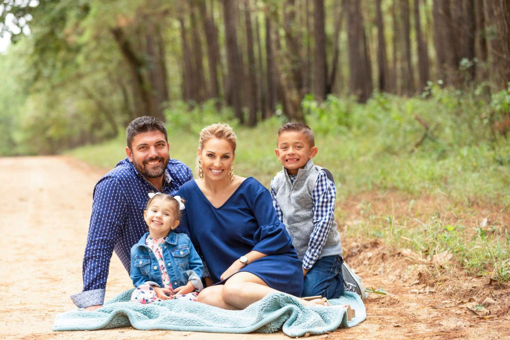 Katy TX family of four in the Huntsville State forest taking fall portraits