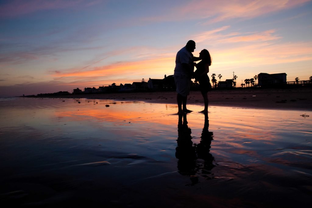 Cypress TX expecting mother and husband on on Galveston beach at sunset
