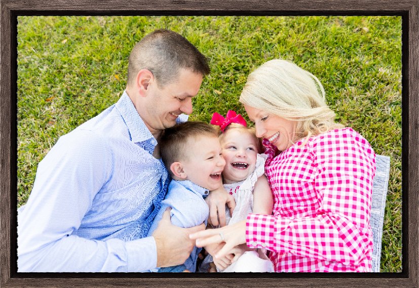 Photo of a framed deckled edge print of a family