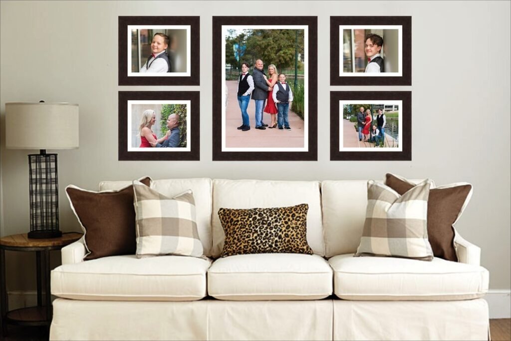 A living room with 5 framed family photos hanging over the couch, created by a full service photography studio.