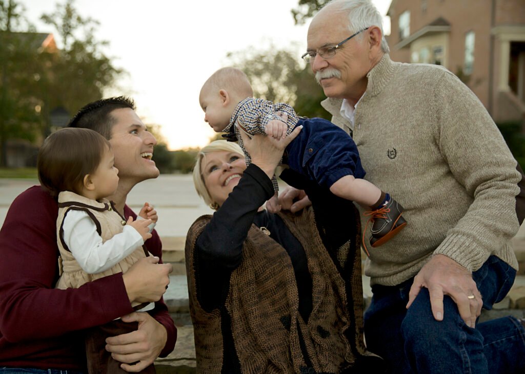 Three generations of a family showing connections in family photos.