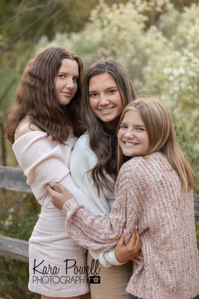 Three sisters posing on a beautiful night for photography