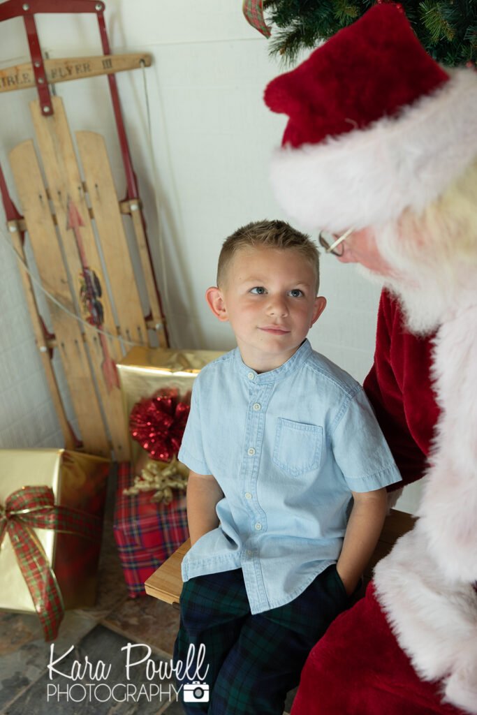 A little boy meets Santa at Kara Powell Photography's Santa Photo Sessions