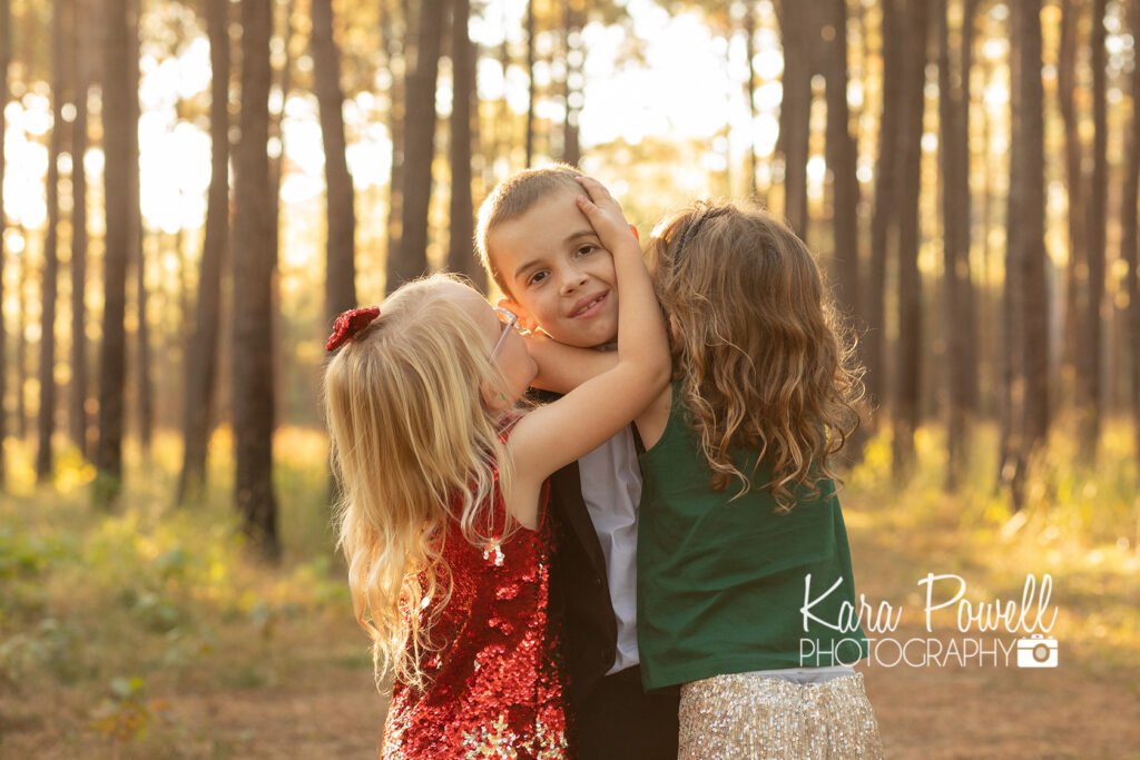 Three siblings hug at their family photo sessions