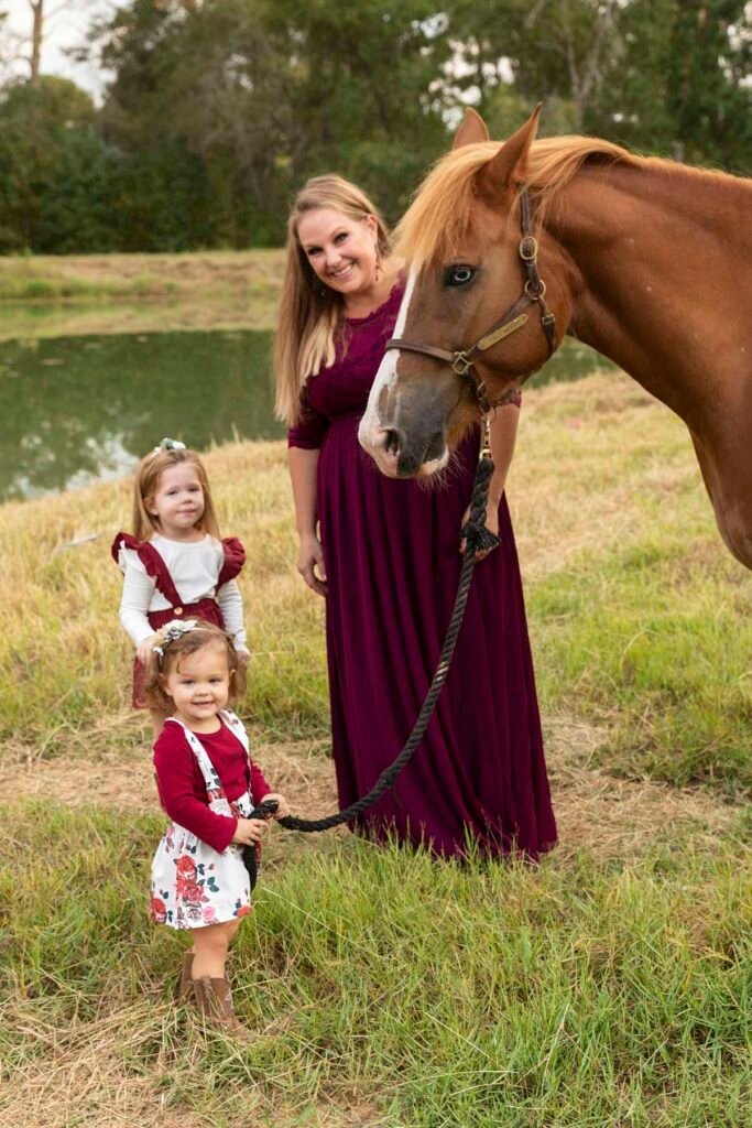 Two little girls with their mother and horse in Conroe TX