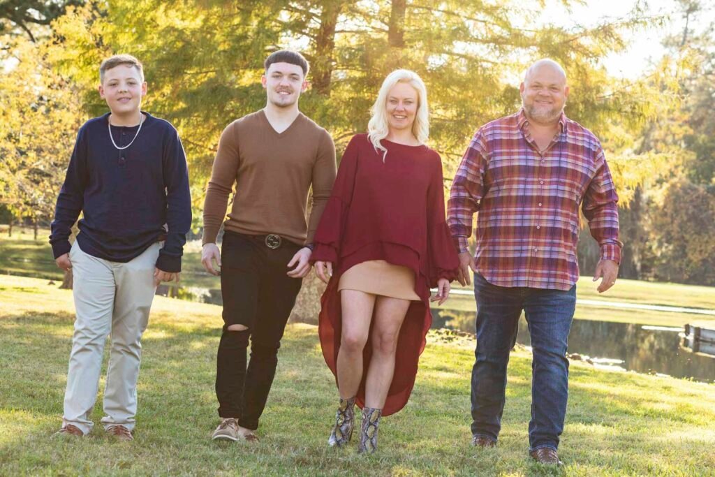 family of four taking fall photos