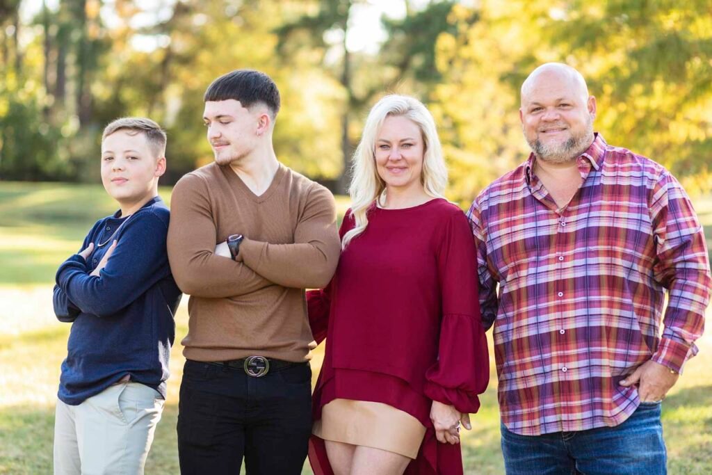 A family of four poses at Townhall TX fall family session