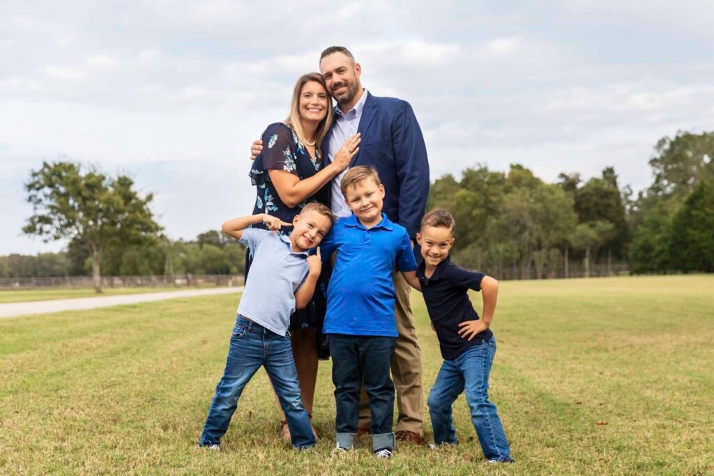 A family of 5 poses together at their crazy fun family photo session