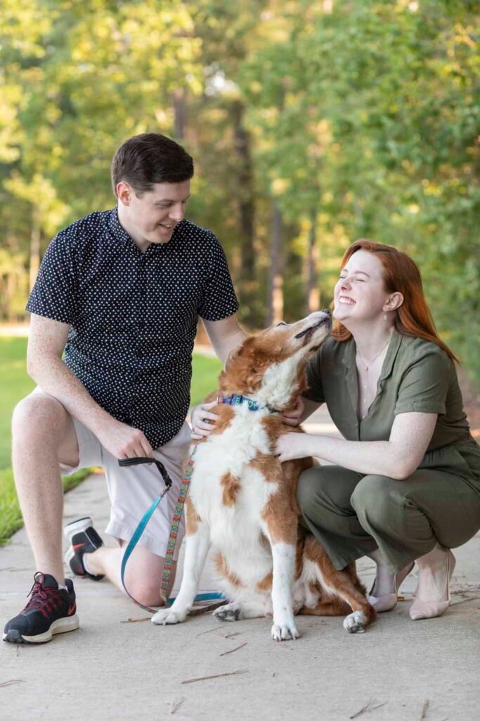 Siblings pose with their dog at Creekside Park Cypress Dog Family Photographer
