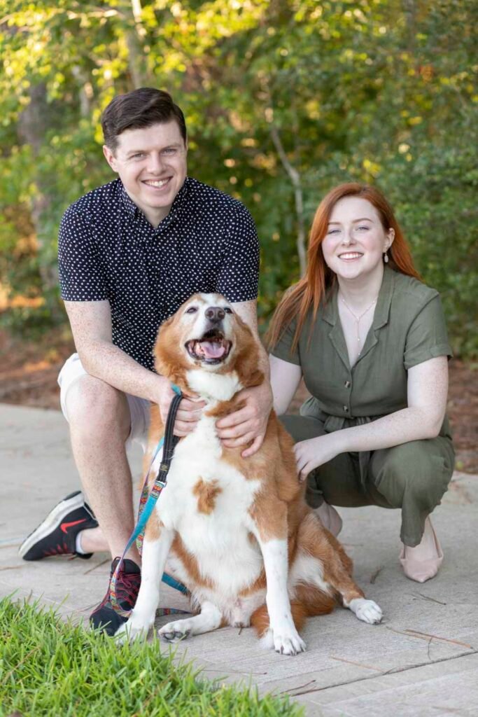 Siblings and their dog pose together at Creekside Park