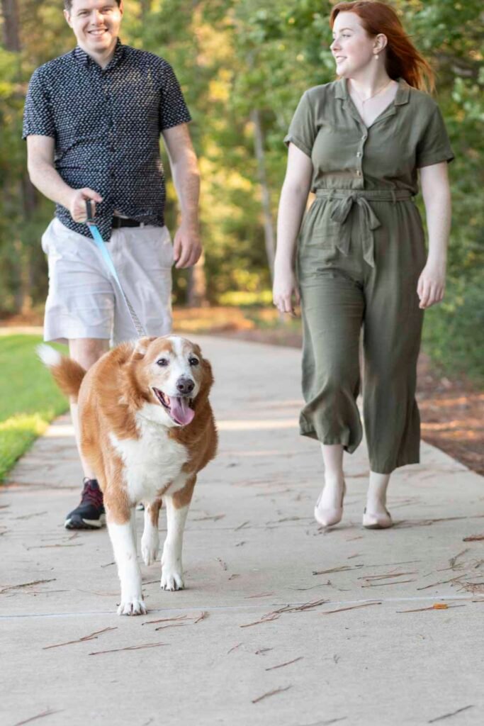 Two teens take their dog for a walk Cypress Dog Family Photographer