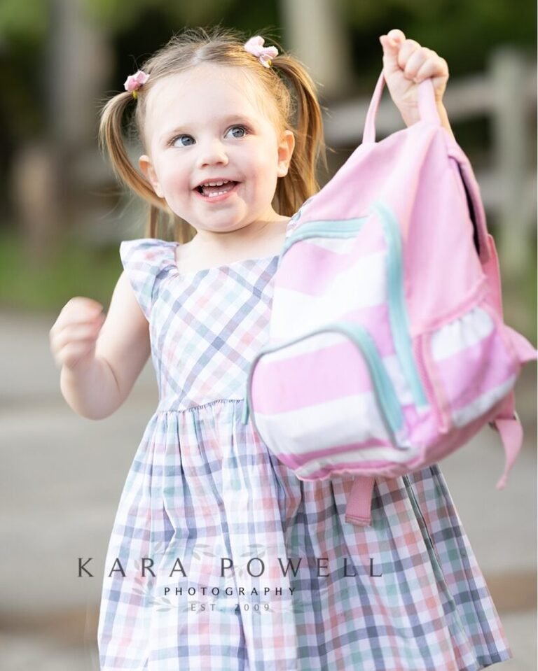 Two year old with her backpack in Tomball TX