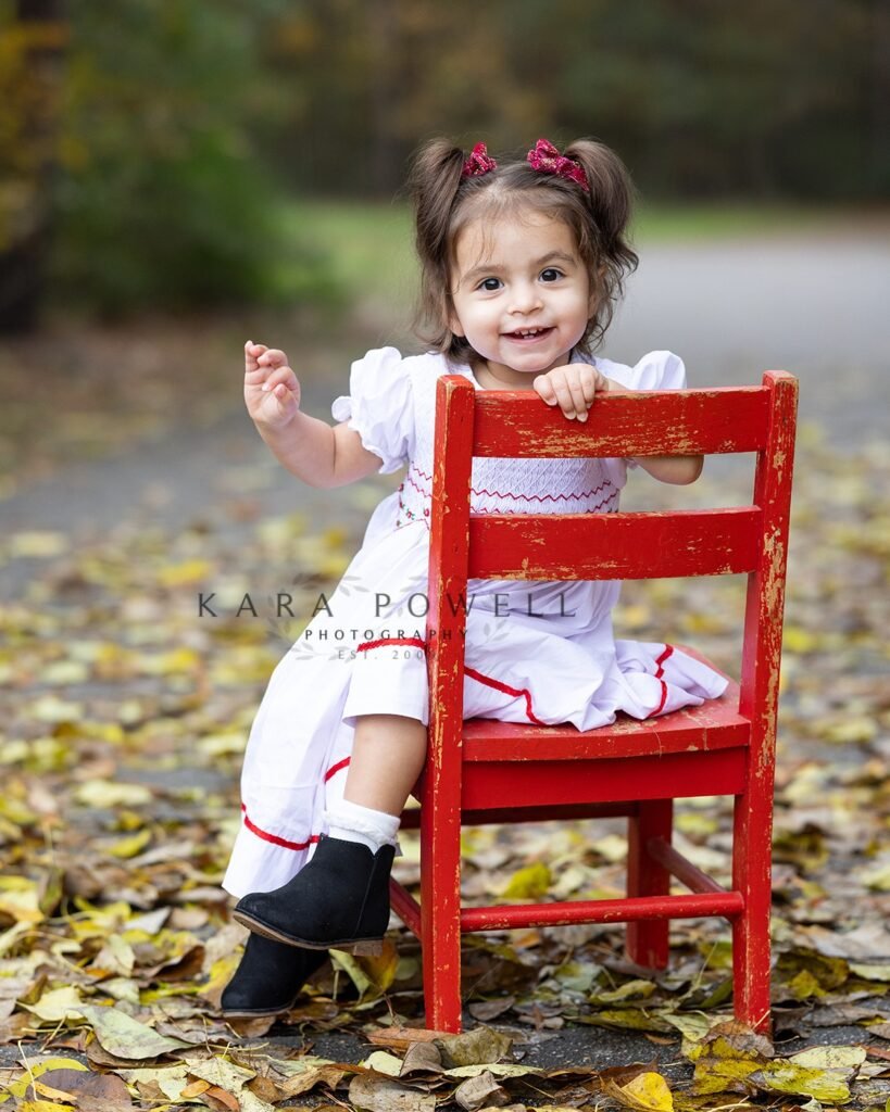 Houston, TX two year old in the fall foliage. Kara Powell Photography