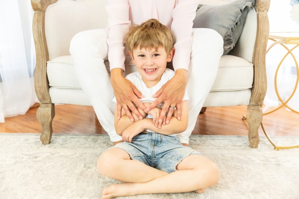 Four year old grin in a studio in the Woodlands TX