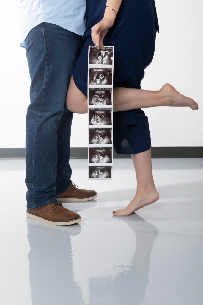 Expecting couple with ultrasound in studio in Magnolia TX