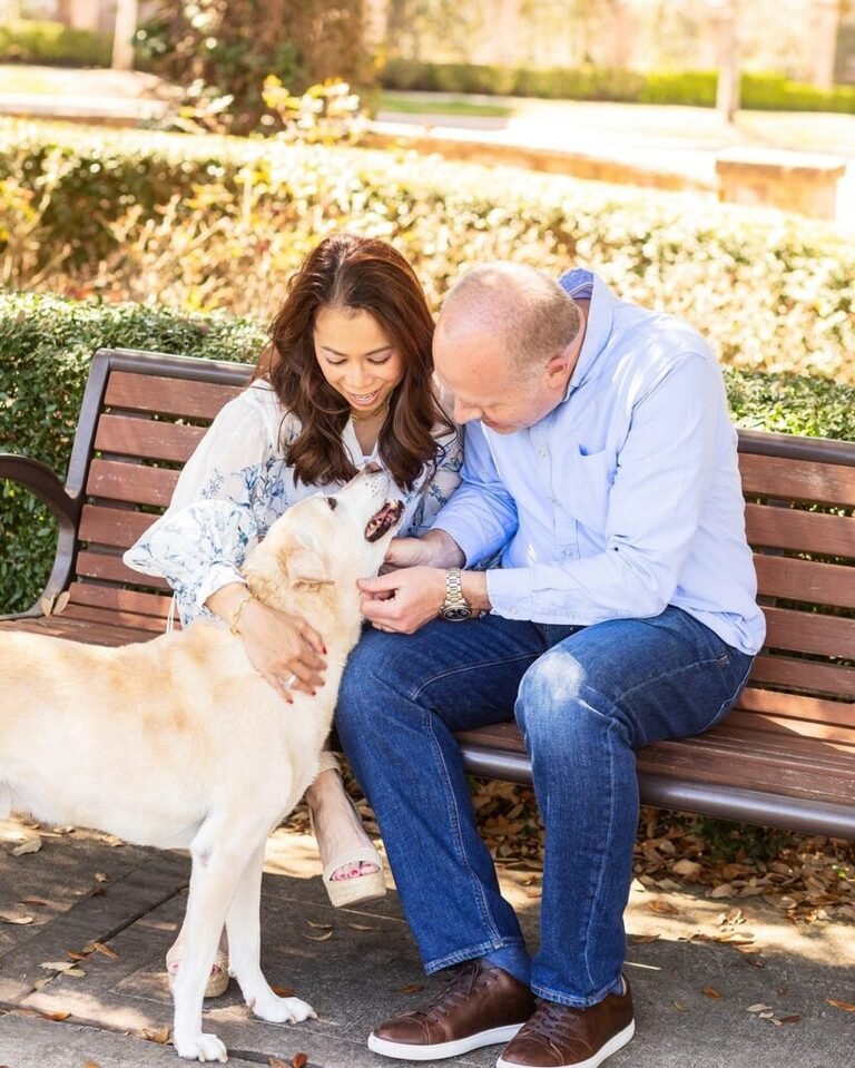 Couple with their elderly dog in the park in the Woodlands TX