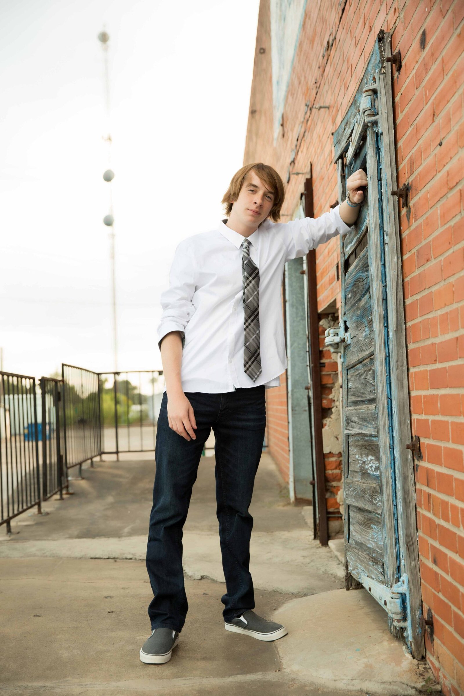 2019 Senior boy in downtown Conroe TX by abandoned building
