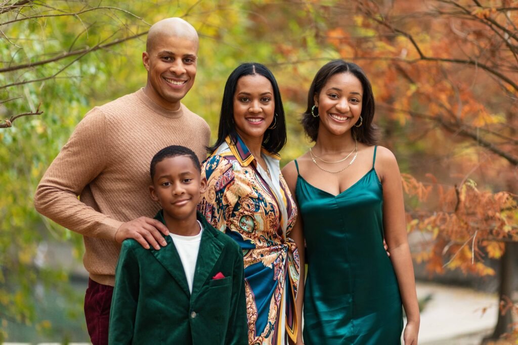 Family of four in the fall foliage in downtown Houston TX