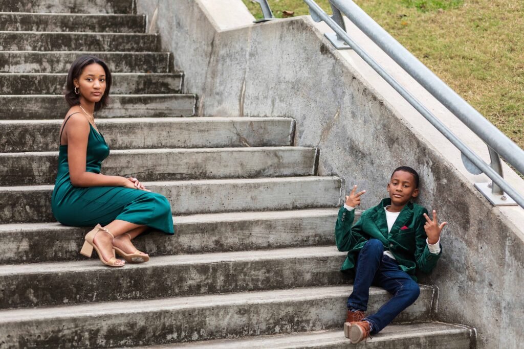 Siblings on stairs in downtown Houston TX