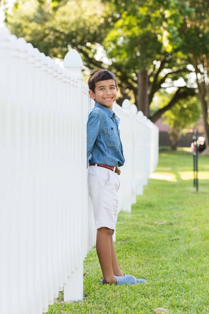 Eight year old in front of historic buildings in Tomball TX