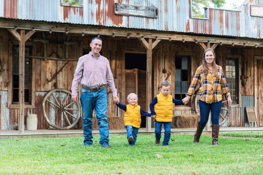 Family of four at wedding venue in Wild West town in Spring TX
