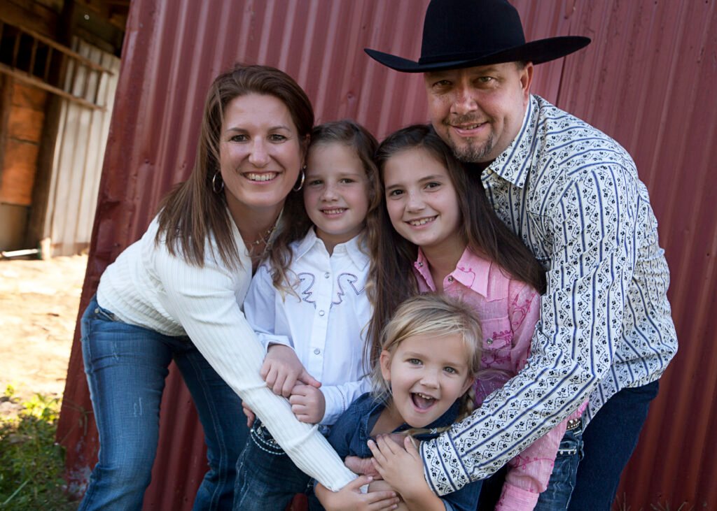 Family of five by barn in Spring TX