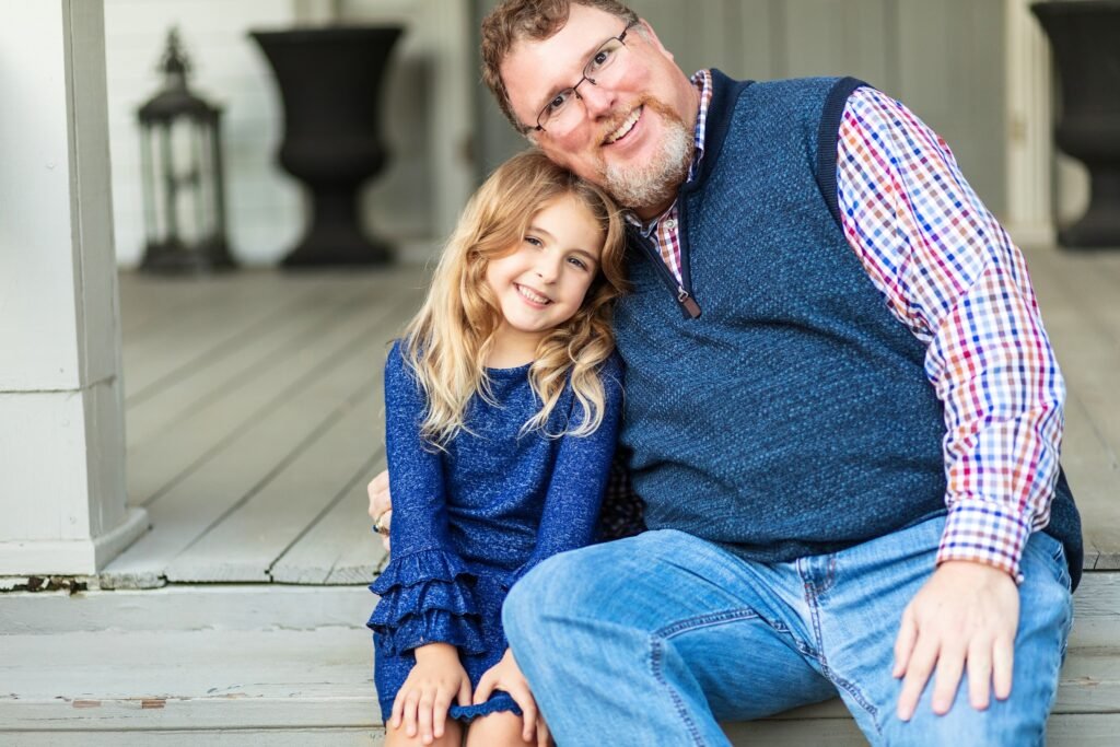 Uncle with niece during fall session in Willis TX