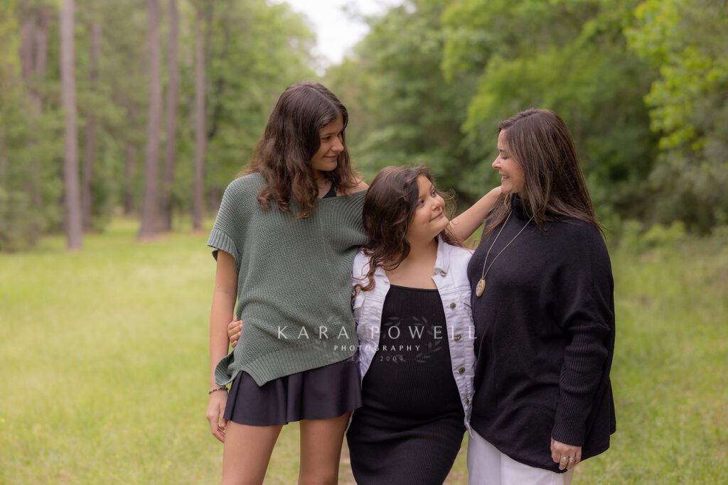 Mother with two daughters in park in the Woodlands TX