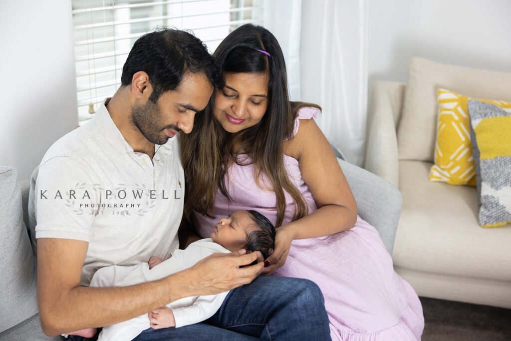 New parents admiring new son in Houston TX