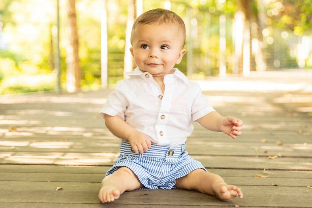 Six month old sitting on bridge in downtown Houston TX