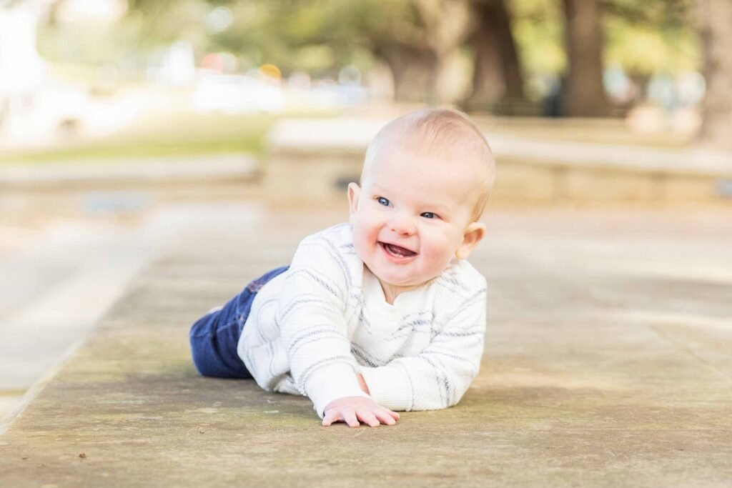 Eight month old sitting outside of Houston TX zoo