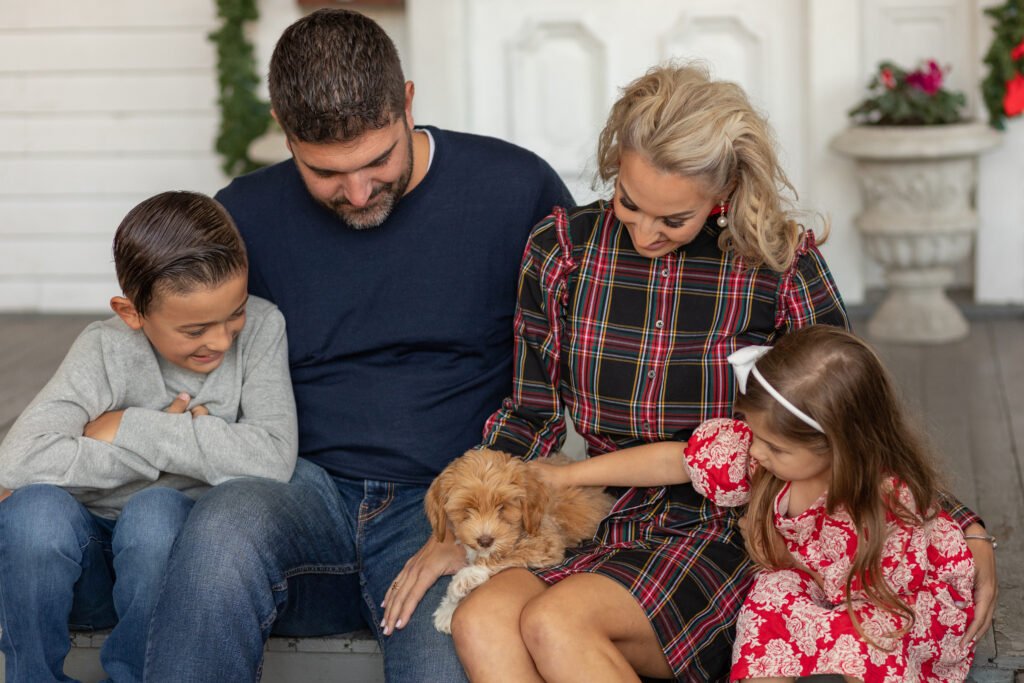 Image of a family photos near me with a dog.