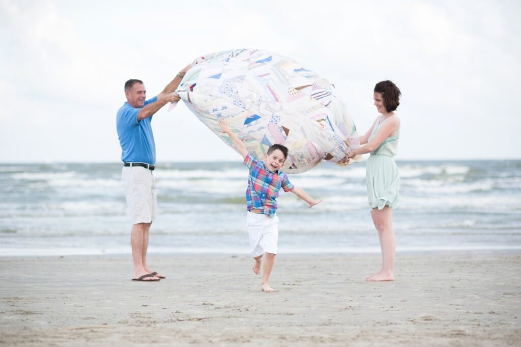 Woodlands TX family playing on Galveston beach.