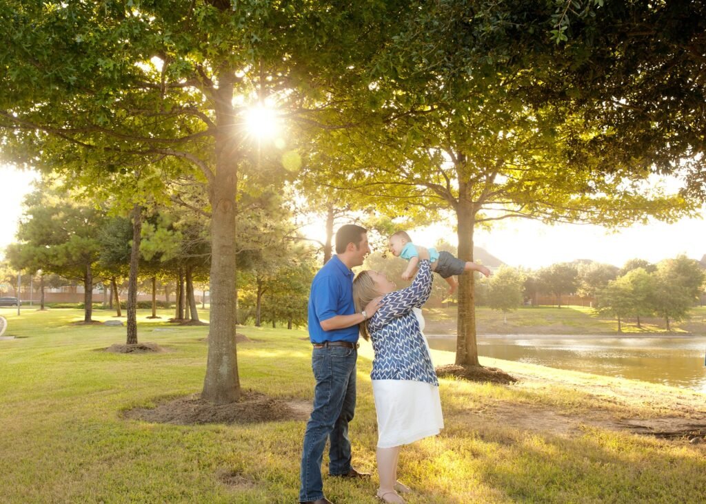 Family of three in the sun; Kara Powell Photography