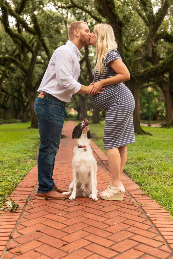 Expecting couple with their dog during their maternity session downtown with Kara Powell Photography.