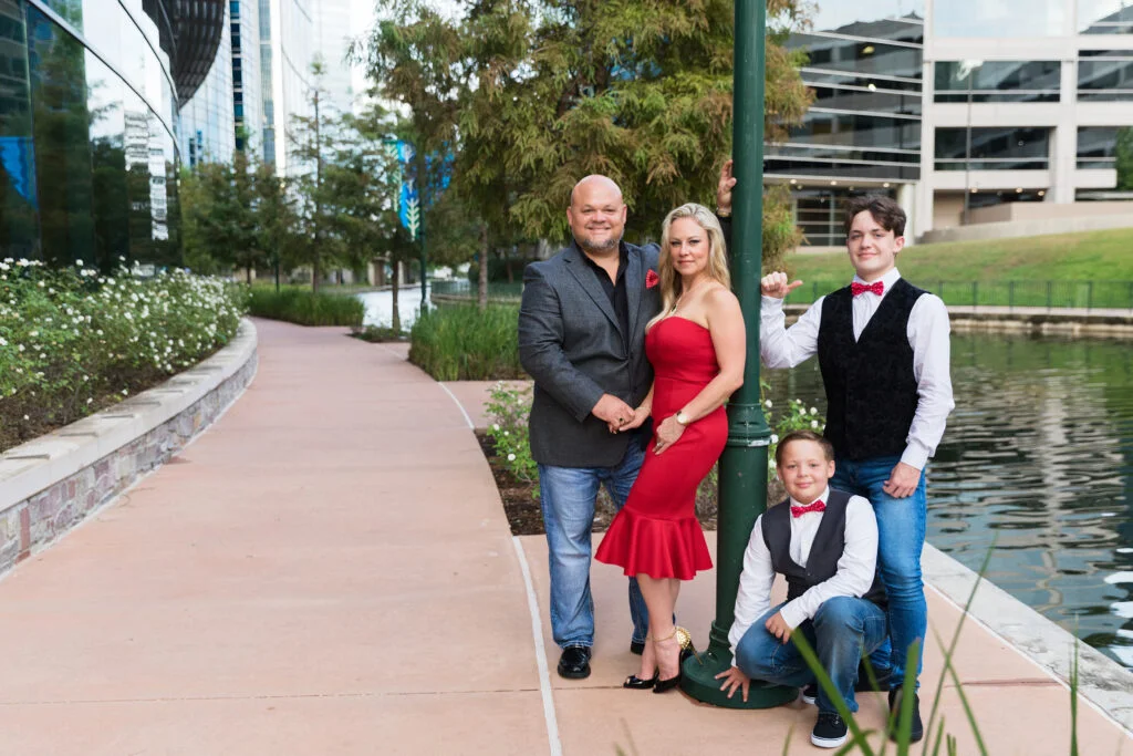 Family of four at the Woodlands Waterway. Taken by Kara Powell Photography.
