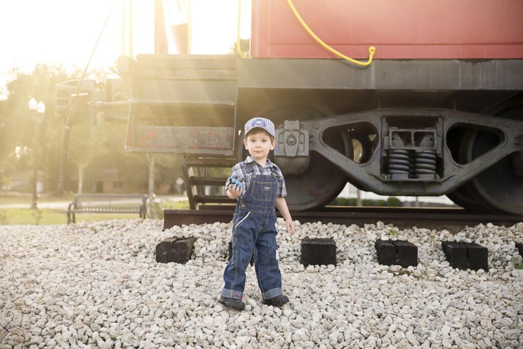 Todder in a trainer engineer outfit during his birthday session. 