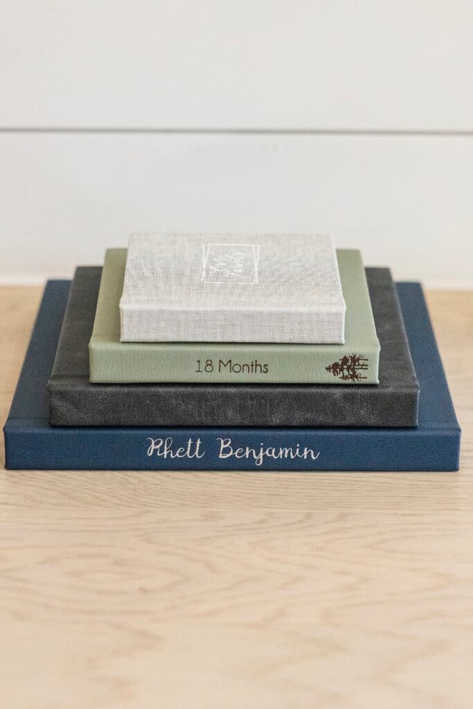 Stack of luxury albums from Kara Powell Photography.